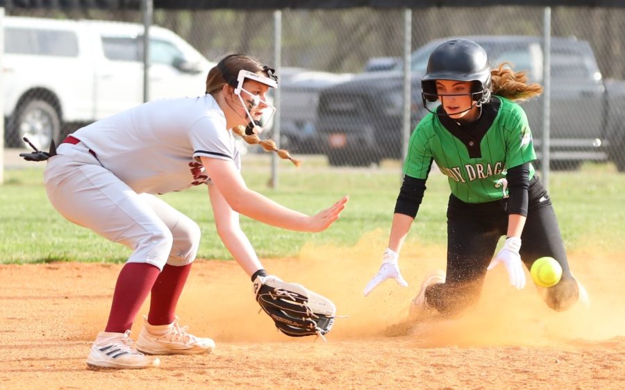 Harlan County shortstop Brittleigh Estep fielded a throw as Harlans Ella Farley was safe at second base. Harlan County pulled away for a 17-4 victory.