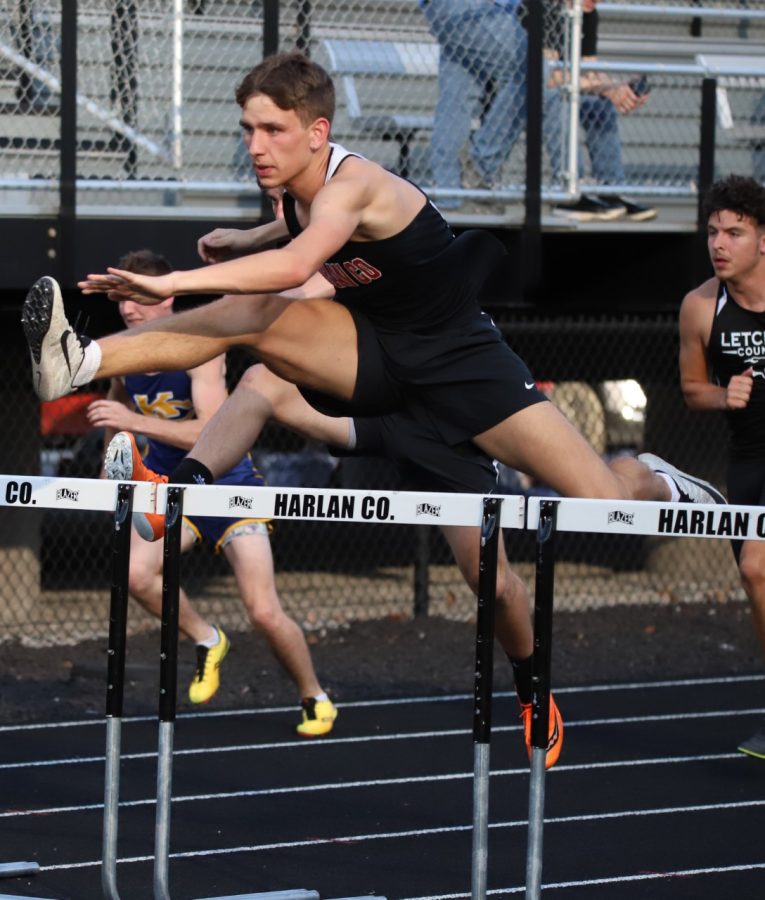 Matt Yeary set a school record in winning the hurdles races Friday at the Harlan County All-Comers Meet.