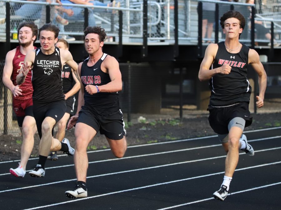 Harlan Countys Luke Carr, pictured in action earlier this season, teamed with Demarco Hopkins, Luke Kelly and Thomas Jordan to set school records in the 100 and 200 meter relays at South Laurel on Friday.