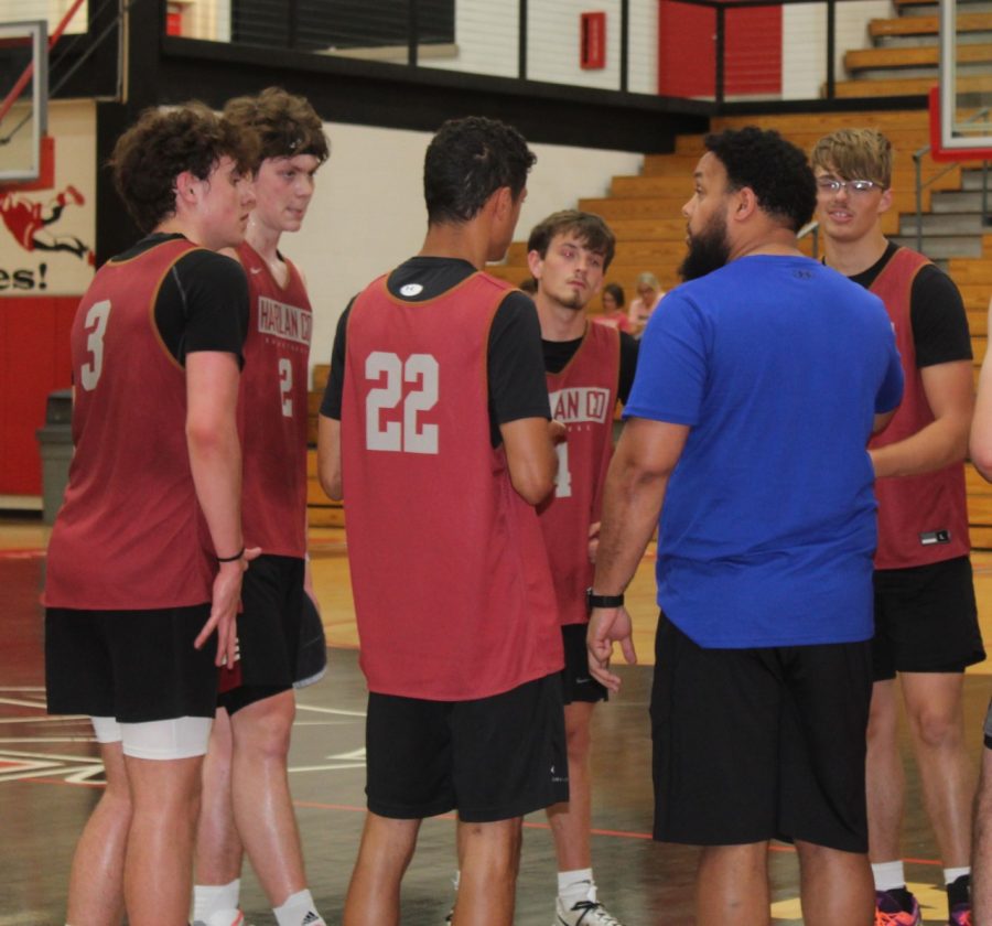 Harlan County coach Gary Greer talked with the Bears during a timeout in scrimmage action Friday at Perry Central. HCHS won 79-77 on a basket by Trent Noah as time expired.,