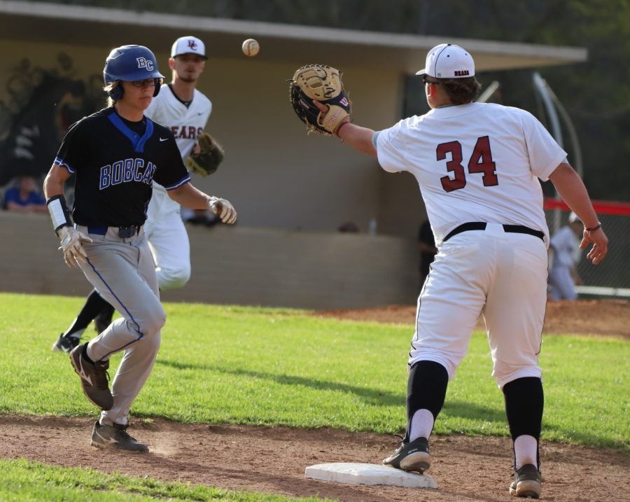 Harlan+Countys+Brayden+Blakley%2C+making+a+throw+to+first+base+earlier+this+season%2C+hit+a+three-run+homer+on+Monday+in+the+Black+Bears+loss+to+visiting+Perry+Central.