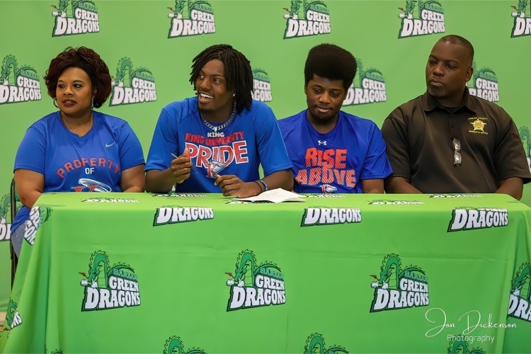 Harlan guard Jordan Akal, the schools second all-time leading scorer, signed with King College on Wednesday in ceremonies at the school. Akal is pictured with his parents, Shawannah and Derrick, and brother, Jalen.