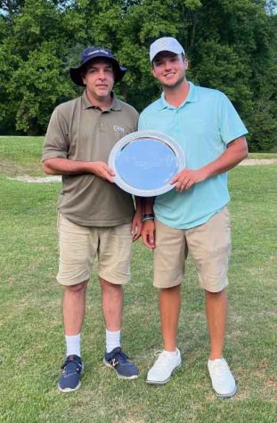 Braxton Caldwell (right) won the Harlan Invitational on Sunday with a five-under par 131. Caldwell received a trophy from Harlan Country Club member Andrew Forester.