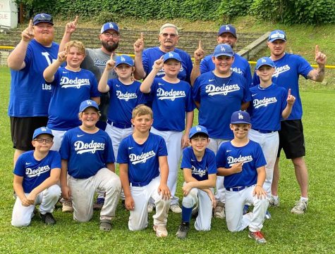 The Benham Lodge Dodgers completed a perfect season in the Tri-City Little League with a hard-fought 4-2 win over the Inmet Mining ankees on June 11 in the league championship game. Team members include, from left, front row: Nathan Harrell, Kyllian Jackson, Tobey Lunsford, Carson McBee and Barrett Baldwin; middle row: Carson Clark, Rayland Burke, Liam Blanton, Byron Shepherd and Elijah Creech; front row: assistant coach David Williams, coach Stephen Creech and assistant coaches Tony Clark, Drew Baldwin and Michael Clark.