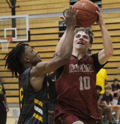 Harlan County junior guard Jonah Swanner went to the basket in action against Woodford County at Frederick Douglass High School. Swanner scored 10 points in the Bears 77-76 victory.