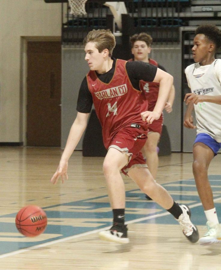 Harlan County sophomore Brody Napier headed down the court in action at the Coastal Carolina Team Camp on Friday.