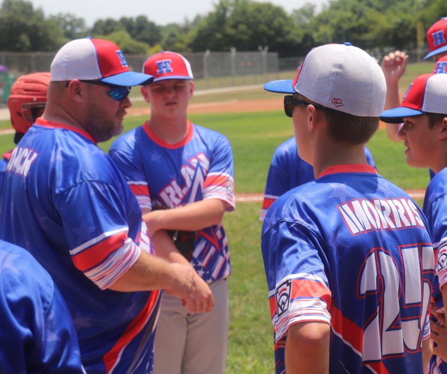 Harlan All-Stars coach Brad Shelton talked with his team between innings in the Junior League State Tournament on Saturday in London. Harlan split two games against Richmond and will play in the deciding third game on Monday at 6 p.m.
