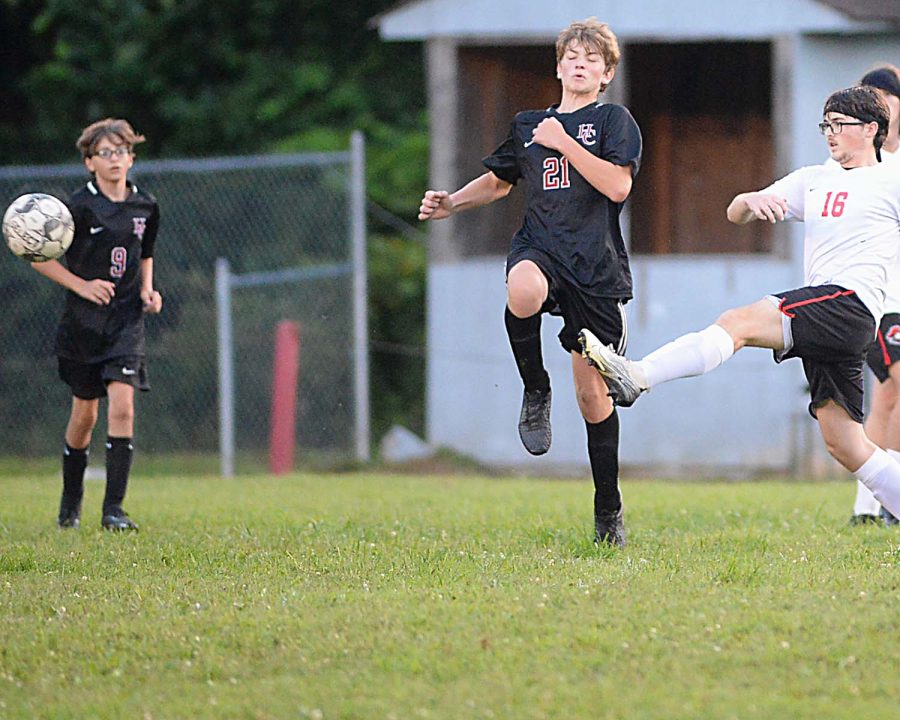 Harlan Countys Luther Gross defended as a Whitley County player advanced the ball in soccer action Monday at the James A. Cawood field. The Bears fell 9-0 before bouncing back with a 4-2 win Tuesday at Middlesboro..