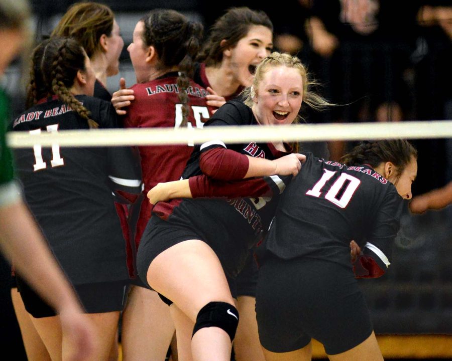 The Harlan County Lady Bears celebrated after finishing off a 25-12, 25-15, 26-24 win Thursday over Harlan.