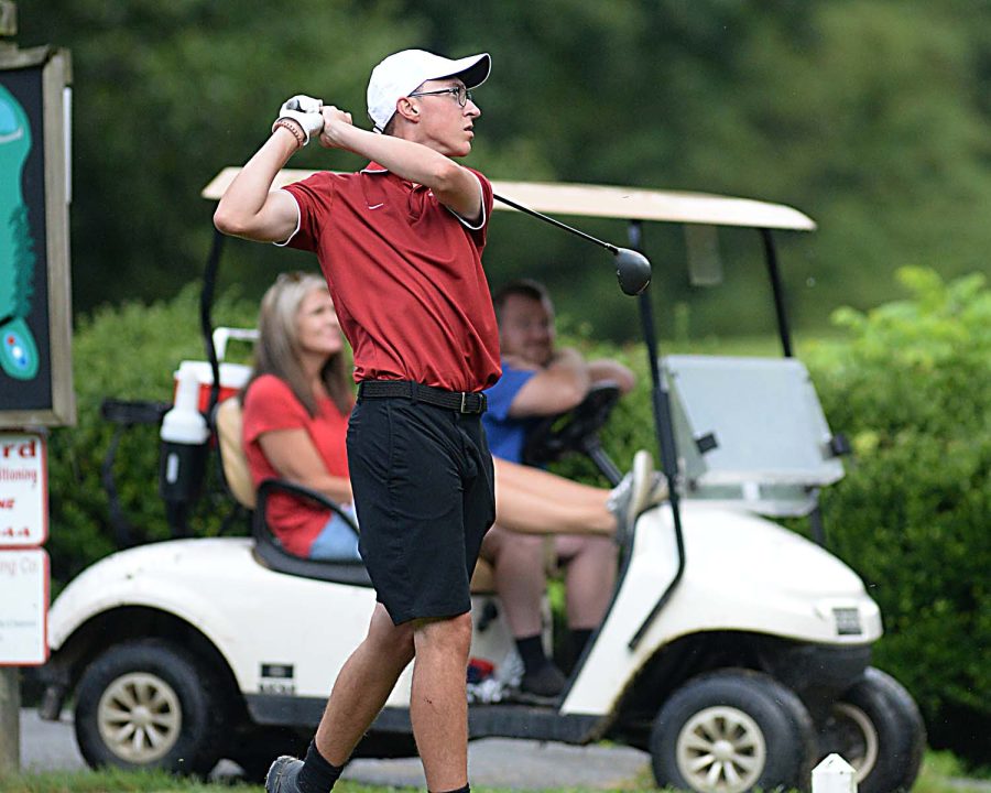 Harlan County senior Matt Lewis watched his shot during Mondays Pine Mountain Golf Conference match at the Harlan Country Club. The Black Bears won the team title by 21 strokes over Middlesboro and Bell County.