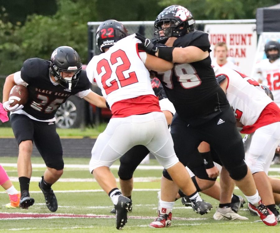 Harlan County sophomore halfback James Ryan Howard followed a block from guard Will Cassim during the Black Bears 43-7 win over South Laurel on Friday.