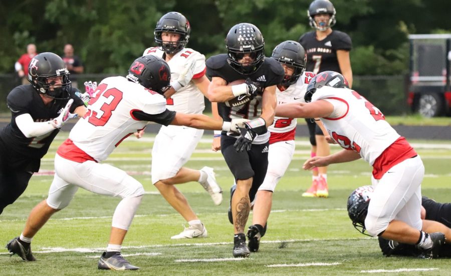 Harlan+County+junior+tailback+Thomas+Jordan+broke+through+the+South+Laurel+defense+for+a+big+game+Friday+in+the+season-opening+FIrst+Priority+Bowl.+Jordan+ran+for+134+yards+and+three+touchdowns+in+the+Black+Bears+43-7+victory.