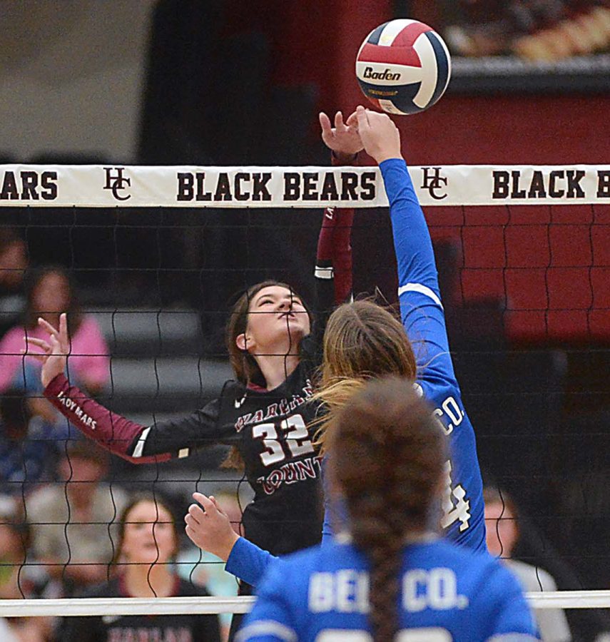 Harlan County junior Destiny Cornett went to the net for a point in a district clash Thursday against visiting Bell County. The Lady Cats clinched the top seed with a 25-19, 25-18, 19-25, 25-22 victory.