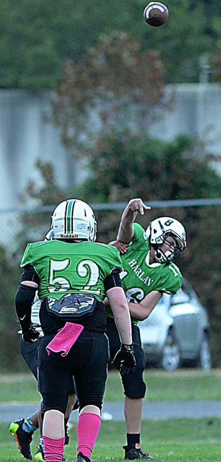 Harlan quarterback Eli Freyer released a pass as a Middlesboro defender applied pressure in middle school football action Thursday.