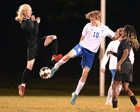 Harlan Countys Hunter Smith went airborne against Barbourvilles Jackson Mills to make contact with the ball during Tuesdays 2-0 win over Barbourville.