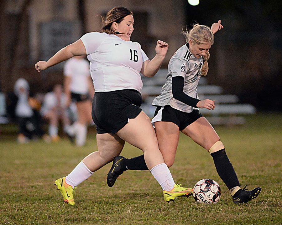 Harlan Countys Victoria Day battled with Middlesboros Morgan Lawson during Tuesdays district clash. The visiting Lady Jackets won 2-1.