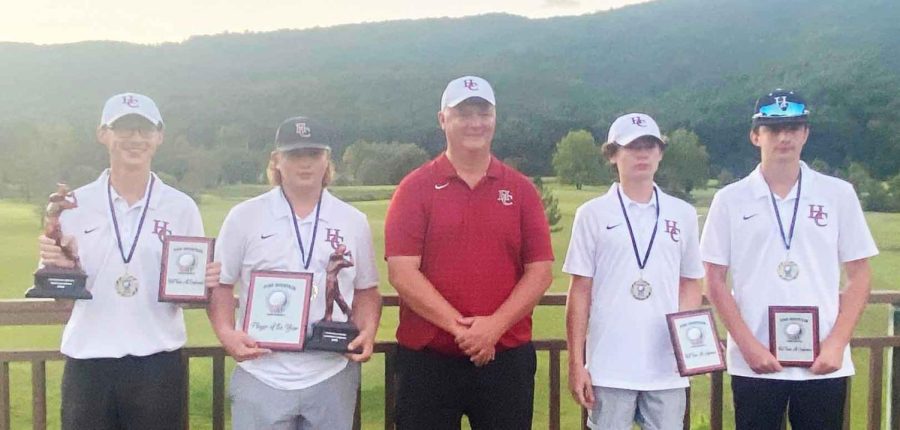 The Harlan County High School golf team won the Pine Mountain Golf Conference title with a 325 on Wednesday, 50 strokes ahead of Bell County. Team members, pictured with coach Greg Lewis, are Matt Lewis, Brayden Casolari, Cole Cornett and Alex Creech.