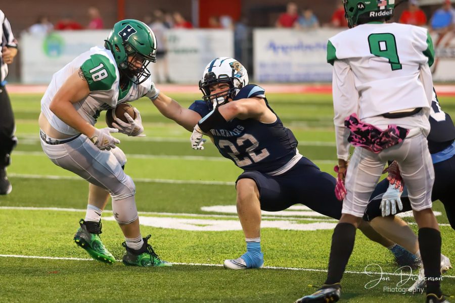 Dylan Middleton battled for yardage in the Green Dragons win over East Ridge. Harlan travels to Middlesboro on Friday.