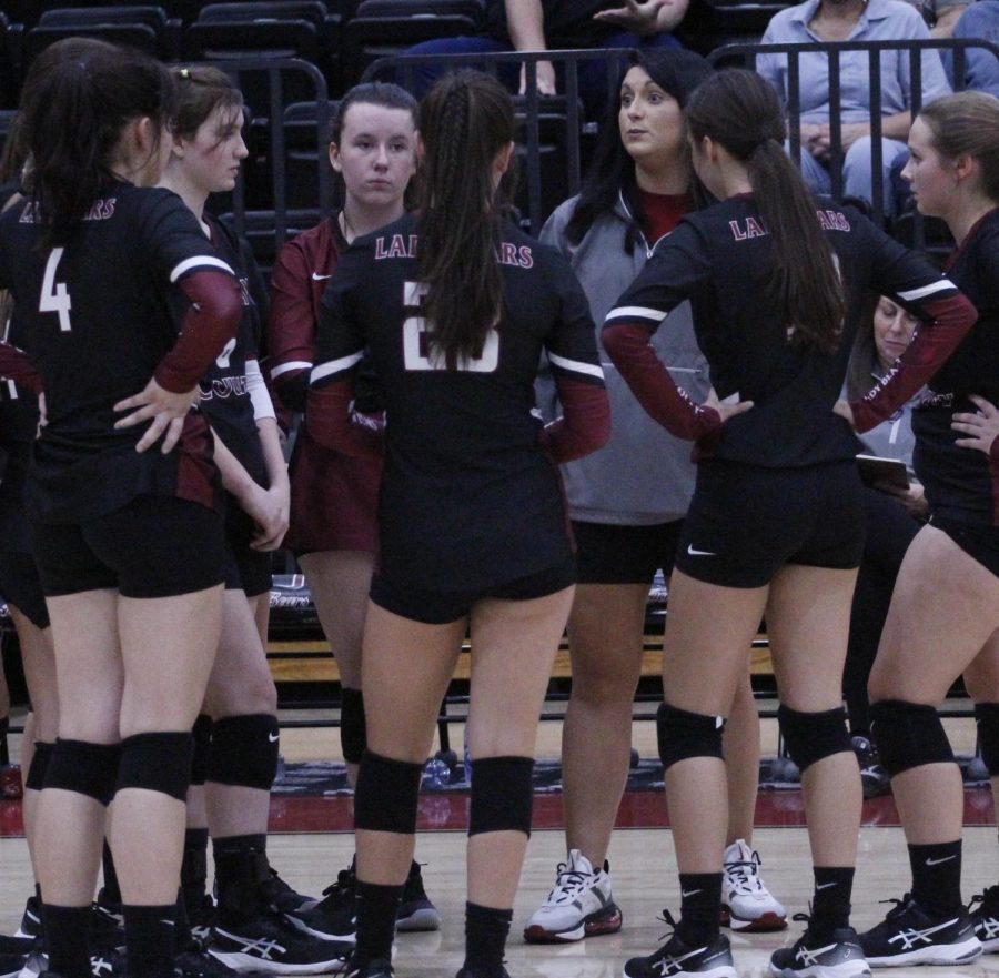 Harlan County coach Christina York talked with her team during a break in Thursdays district match against Middlesboro. The Lady Bears won in three sets to improve to 3-2 on the season.