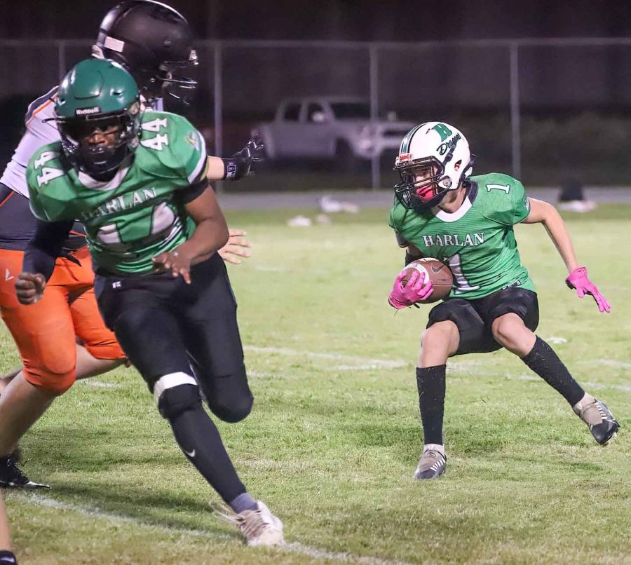 Harlan running back Jonah Sharp scored two touchdowns in the Green Dragons 18-16 win Thursday over visiting Lynn Camp in middle school football action.