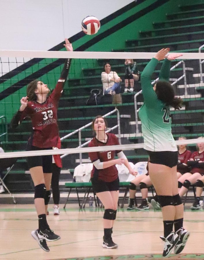 Harlan Countys Destiny Cornett went to the net for a shot against Harlans Carley Thomas in a district clash Thursday at Harlan. The Lady Bears won 25-16, 19-25, 25-15, 25-21.