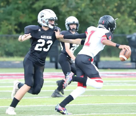 Harlan Countys Tyler Coots went after the South Laurel quarterback in middle school football action Thursday. The Bears won in eighth-grade action and lost in the seventh-grade game.