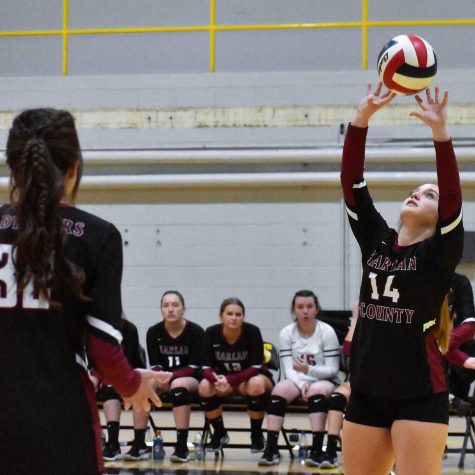 Harlan County freshman Savannah Hill set the ball in district tournament action against Harlan on Monday.