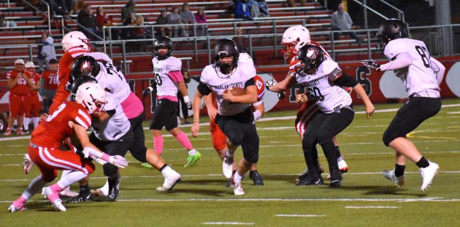 Harlan County junior receiver/quarterback Jonan Swanner followed blocks by seniors Connor Blevins, Issac Downs, Johnny Brock and Austin Roark on his way to a touchdown in the Bears win Friday at Perry Central. The Bears will honor their seniors before Fridays game against Bell County.