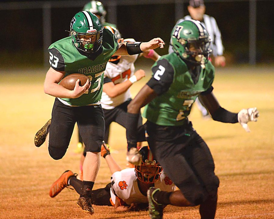 Harlan running back Jayden Ward followed a block from WIll Austin in last weeks win over Lynn Camp. The Green Dragons return to action Friday at home against Pineville.