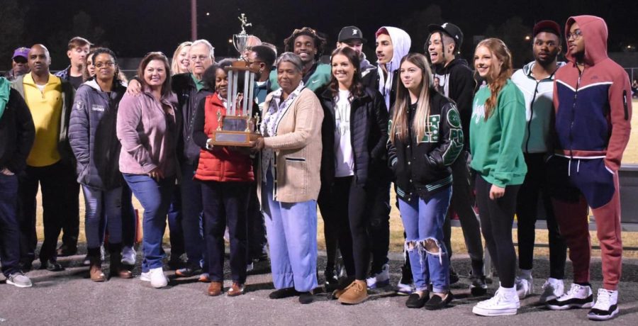 Several former Harlan track stars were honored in ceremonies Friday at halftime of the Green Dragons game against Lynn Camp. The 1972 state championship team was also honored as Donna Walker, a nine-time state champion in individual events over three years, held the trophy.

