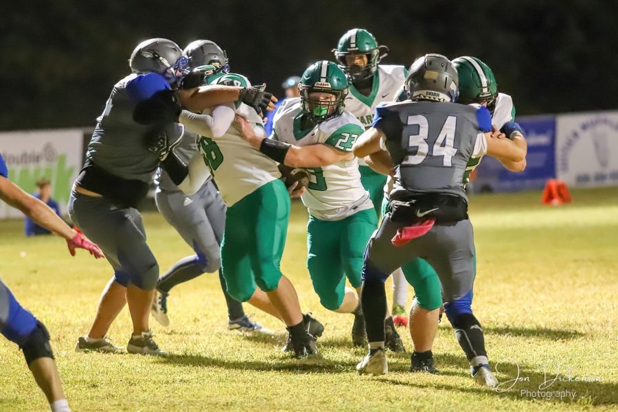 Harlan running back Jayden Ward followed his blocks for a gain in last weeks game against Phelps. The 5-1 Green Dragons return to action Friday at Williamsburg.