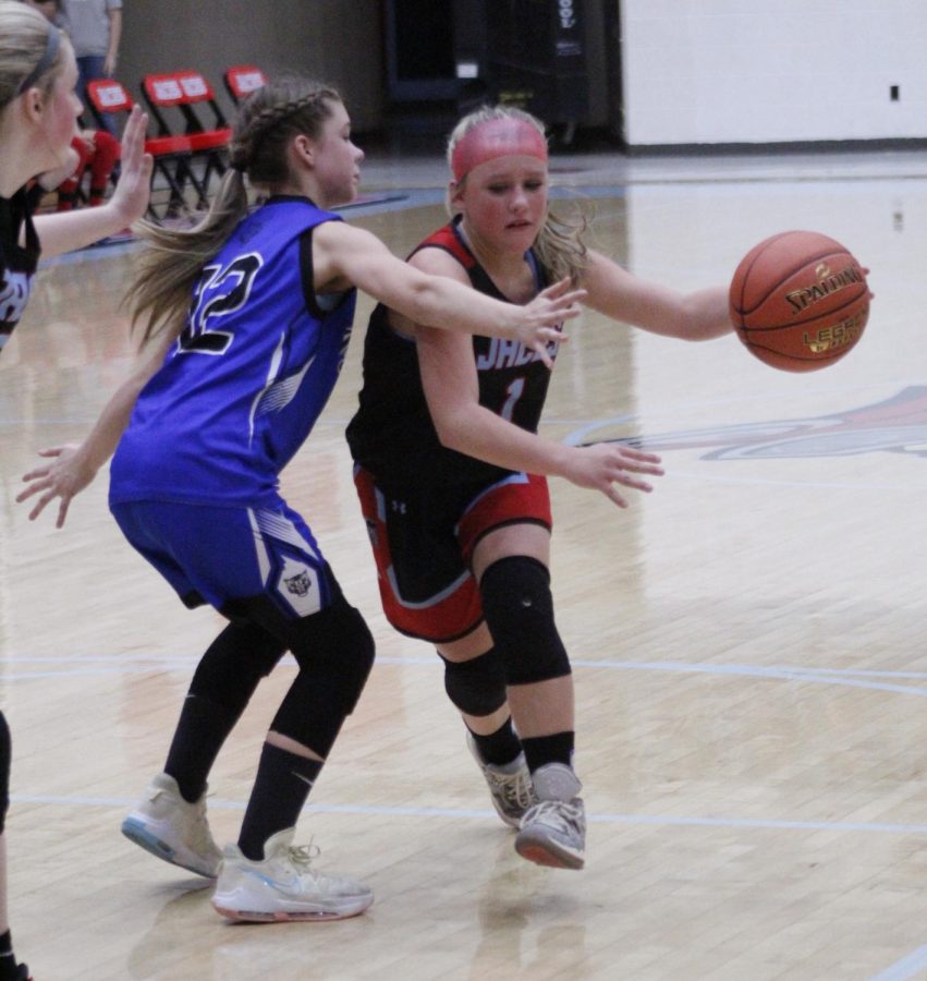 James A. Cawood guard worked toward the basket in action from the fifth- and sixth-grade county tournament. The Trojanettes advanced to the finals with a 31-27 victory.