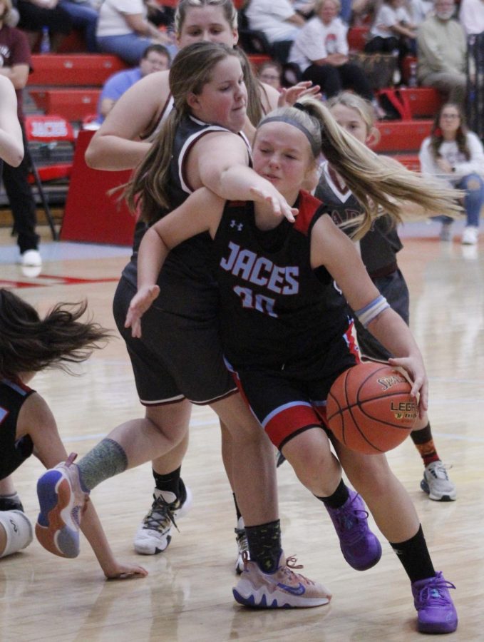 James A. Cawoods Taylynn Napier drove around a Cumberland defender in the Trojanettes win in county tournament action.