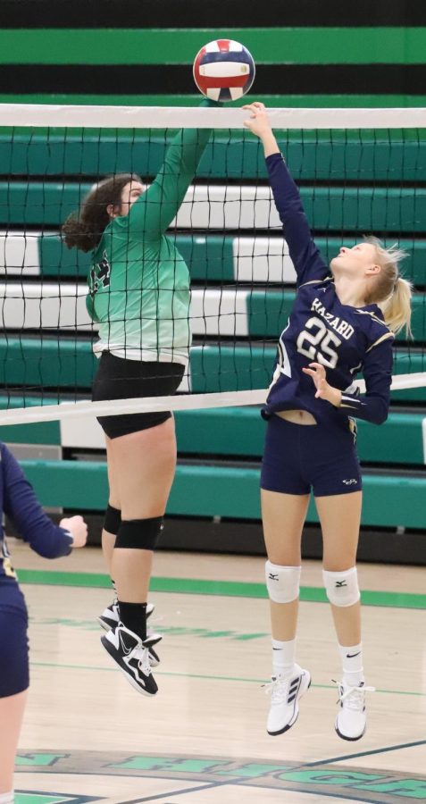 Harlans Carley Thomas and Hazards Miley Gadbury, both sophomores, battled at the net in action Saturday. The visiting Lady Dogs won in three sets.
