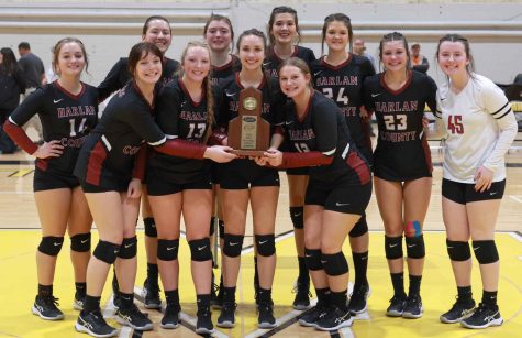The Harlan County Lady Bears are pictured with their championship trophy after defeating Bell County in five sets on Tuesday in the 52nd District Tournament finals at Middlesboro.