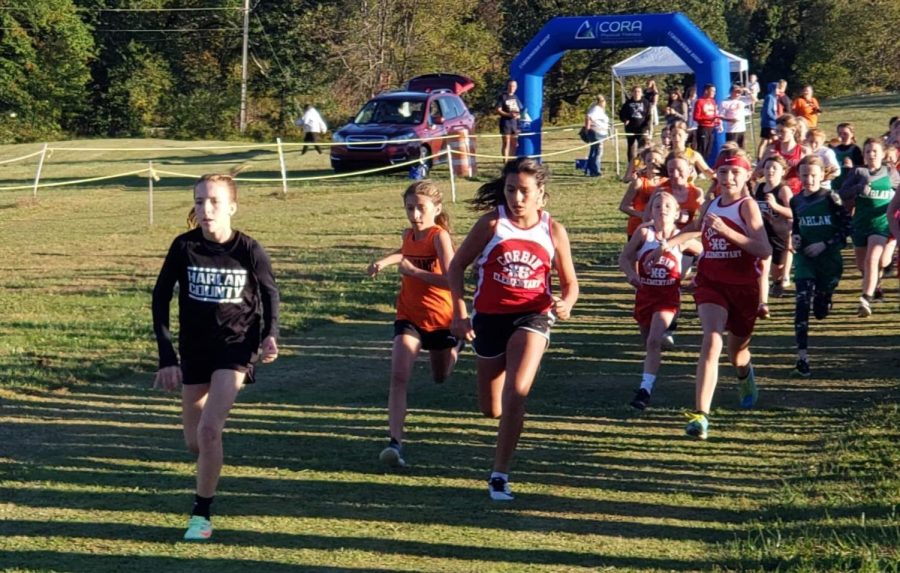 Rosspoint+sixth-grader+Jaycee+Simpson+%28left%29%2C+representing+Harlan+County%2C+was+the+winner+in+the+13th+Region+elementary+school+race+Monday+at+Lynn+Camp+High+School.