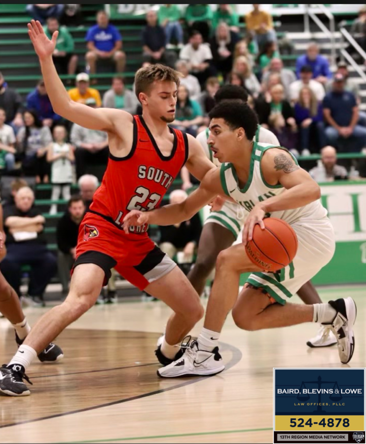 Harlan guard Kaleb McLendon worked against South Laurels Parker Payne in the season opener for both teams on Tuesday. The Green Dragons won 71-63.