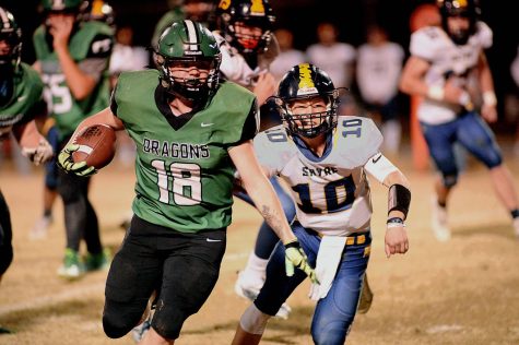 Harlan senior fullback Dylan Middleton broke free for a big gain in the Green Dragons 42-7 win last week over Sayre. Middleton and the Dragons travel to Pikeville on Friday.