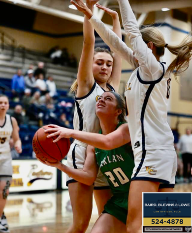Harlan guard Emma Owens found herself trapped by two Knox Central defenders in Mondays game in Barbourville. Knox Central pulled away in the second half for a 74-52 victory.