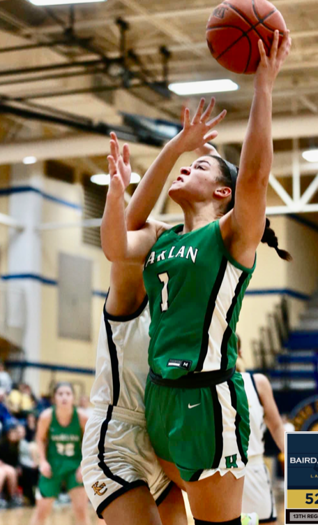 Harlan+guard+Kylie+Noe%2C+pictured+in+action+earlier+this+season%2C+had+16+points+and+14+rebounds+in+the+Lady+Dragons+loss+to+Leslie+County+on+Tuesday.