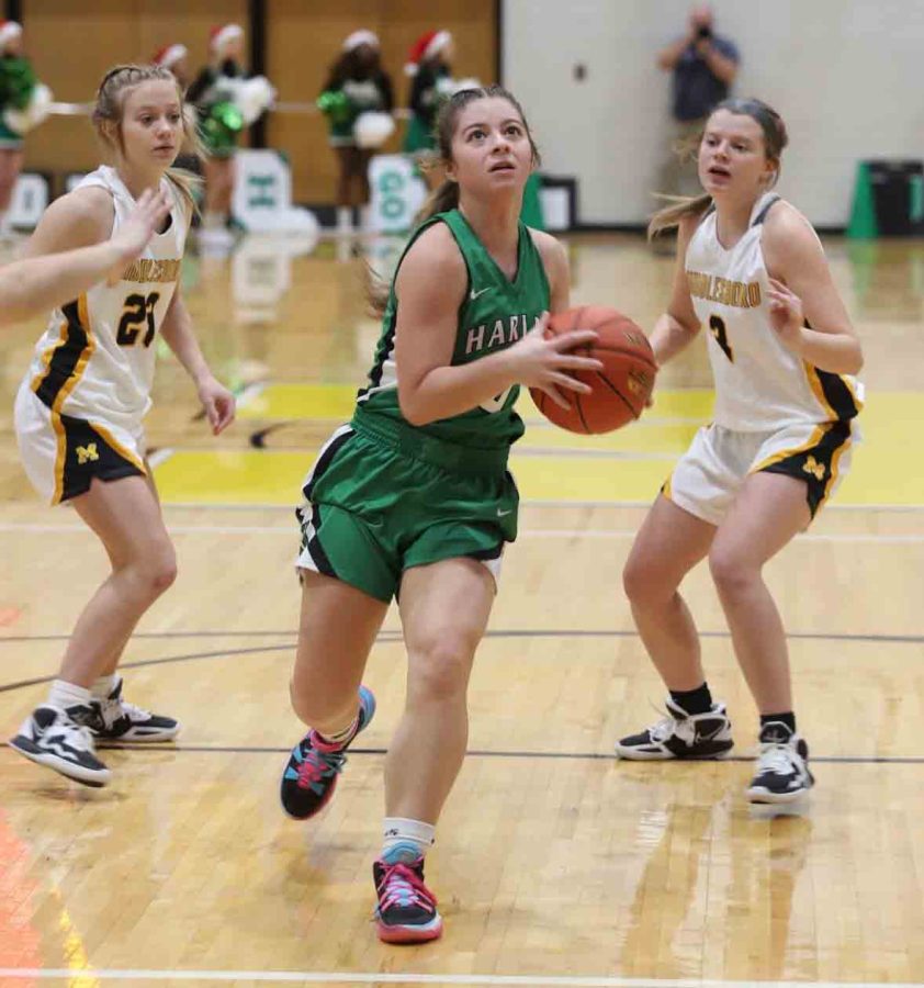 Harlan junior point guard Emma Owens coasted down the lane for two of her 21 points on Friday in the Lady Dragons 68-31 victory.