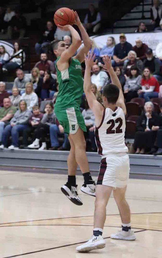 Harlan guard Kyler McLendon put up a shot over a Pikeville defender on Monday. McLendon scored 15 points in the Dragons 73-61 victory.