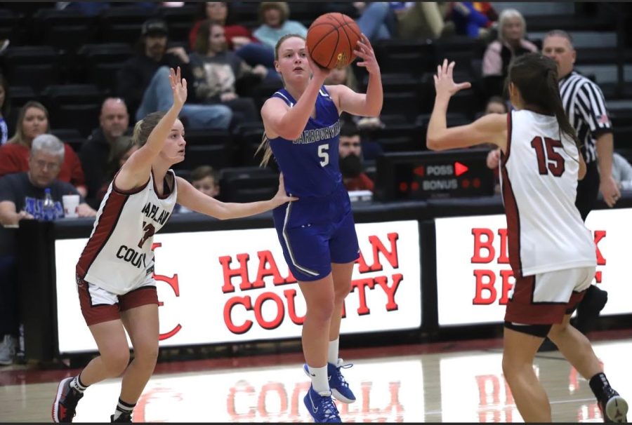 Barbourville guard Sarah Smith shot as Harlan Countys Taytum Griffin and Ella Karst defended in Mondays game at the HCHS gym.