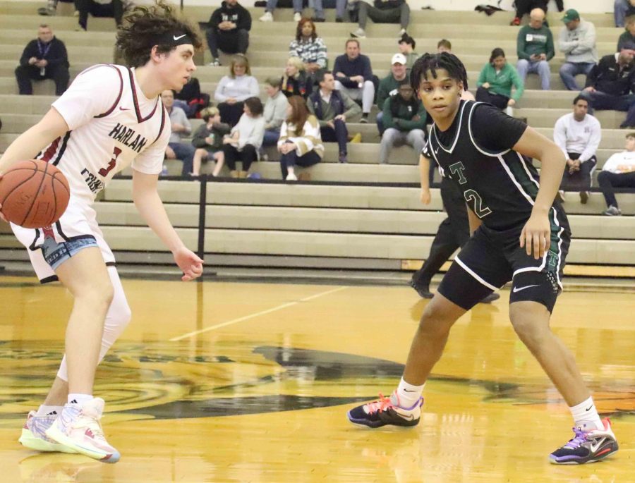 Harlan Countys Maddox Huff worked against Trinity guard Andrae Vasser in Tuesdays game in the King of the Bluegrass. Trinity won the consolation bracket of the tournament with a 74-62 win over the Bears, who finished 2-2 in tournament action.