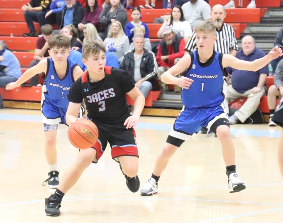 James A. Cawood guard Landon Brock worked his way down the lane in middle school basketball action Thursday against Rosspoint. Brock scored 26 points in the Trojans 46-43 win.