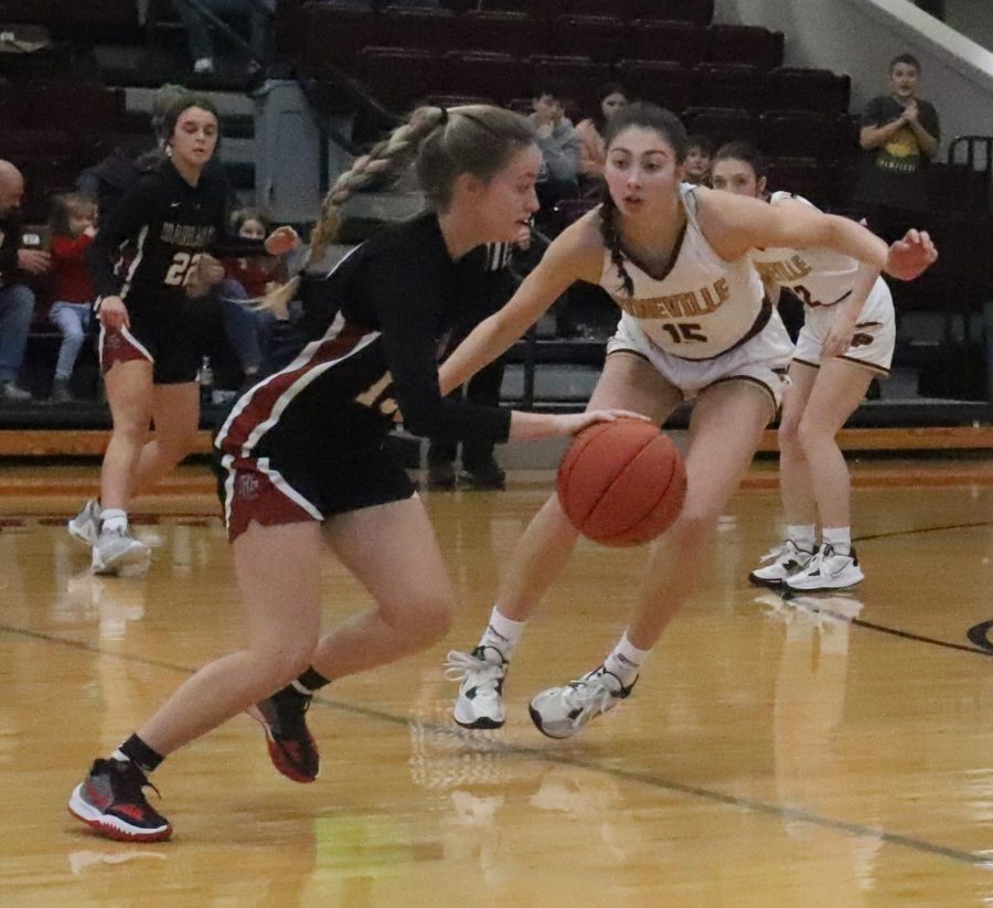 Harlan County senior guard Taytum Griffin worked around Pinevilles Ava Arnett in Thursdays game at the Chain Rock Classic in Pineville. Griffin scored 10 points in the Lady Bears 51-46 victory.