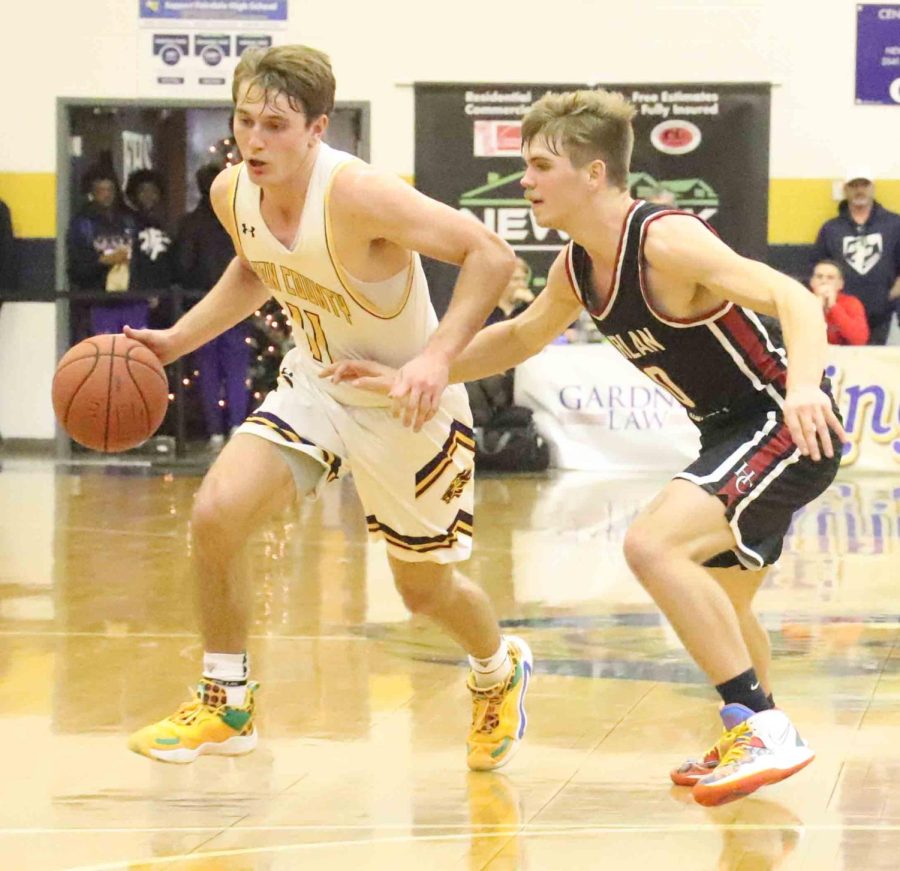 Harlan Countys Jonah Swanner guarded Lyon County star Travis Perry during the King of the Bluegrass tourney at Fairdale High School.