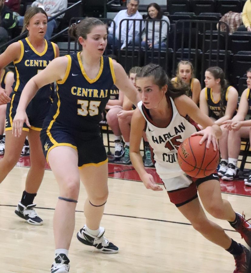 Harlan County point guard Ella Karst drove the baseline against Knox Centrals Halle Collins in Thursdays game. Karst led the Lady Bears with 23 points, but Collins had 26 to lead Knox to an 81-60 victory.