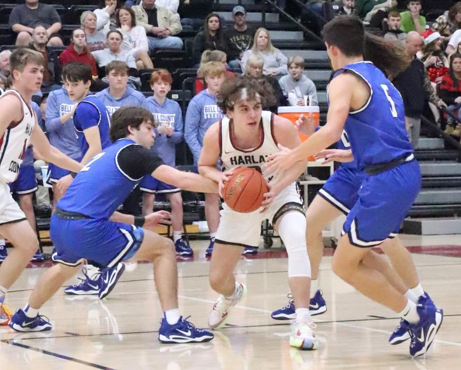 Harlan County guard Maddox Huff was surrounded by Bell County defenders in Tuesdays game. Huff scored 16 points in the Bears 76-65 victory.
