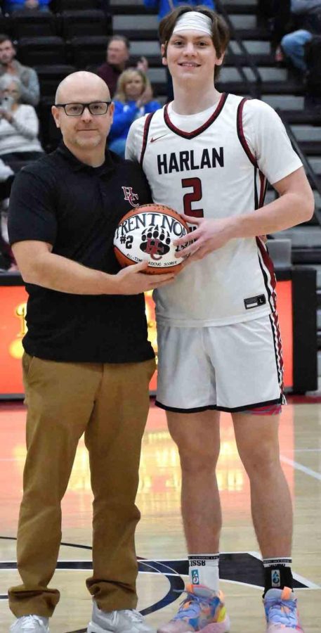 Harlan+County+junior+guard+Trent+Noah+was+honored+for+breaking+the+all-time+scoring+record+at+Harlan+County+High+School+earlier+this+season.+Noah+received+a+commemorative+basketball+from+HCHS+coach+Kyle+Jones.+Noah+scored+36+points+Tuesday+in+the+Bears+76-65+win+over+Bell+County.